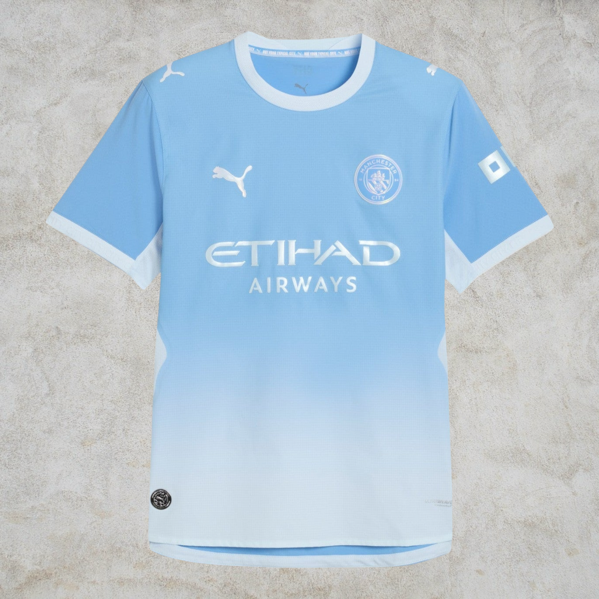 Malvros Manchester City light blue performance soccer jersey with white accents, club crest, and sponsor logos.