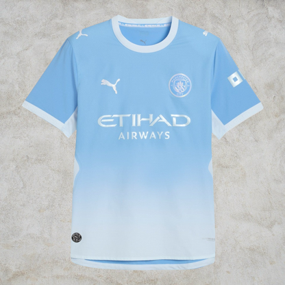 Malvros Manchester City light blue performance soccer jersey with white accents, club crest, and sponsor logos.