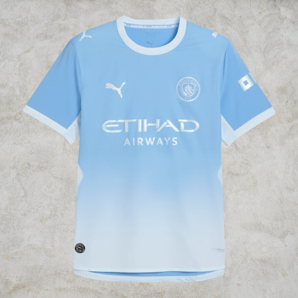 Malvros Manchester City light blue performance soccer jersey with white accents, club crest, and sponsor logos.